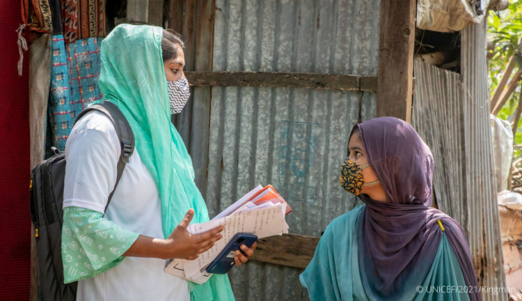 A volunteer child protection worker speaks with a client in Bangladesh