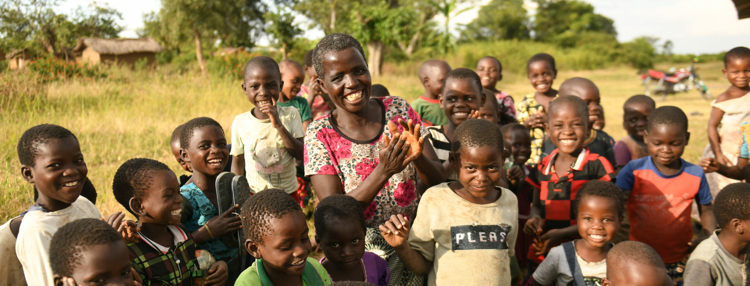 Childrens Corner facilitator plays with children in Malawi