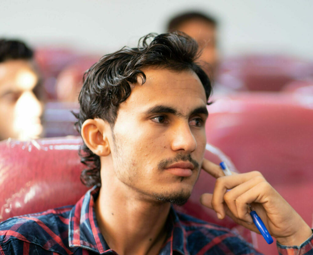 Student listens during a lecture in Yemen